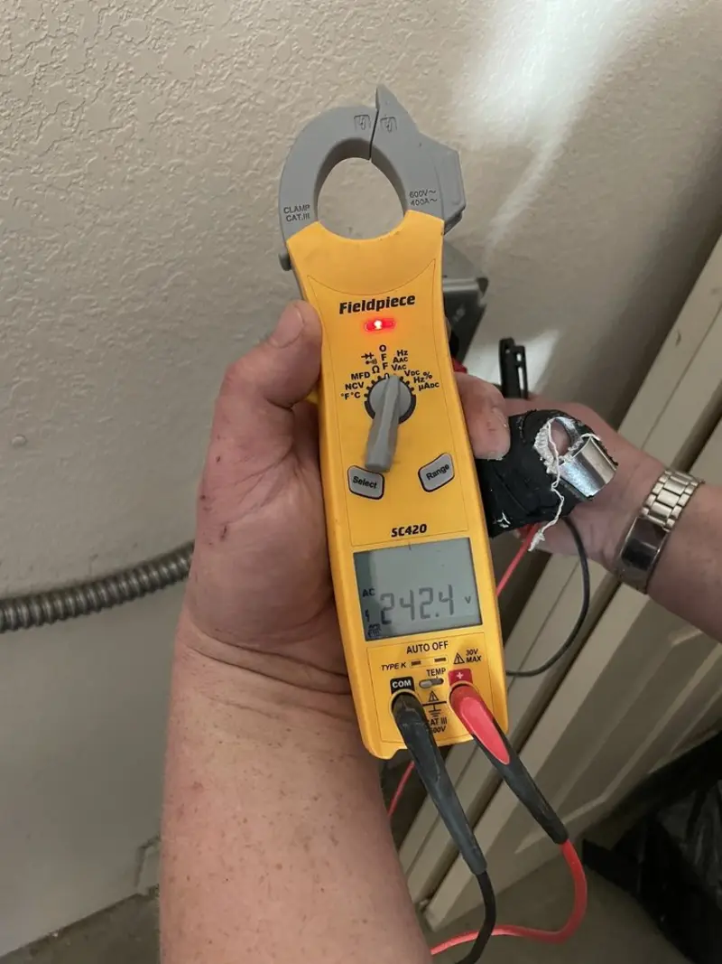 Voltage testing with clamp meter during Whole House Surge Protector in Lloyd